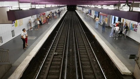 Green trains of the Paris subway system arrive and depart a metro station Stock Footage 101893446