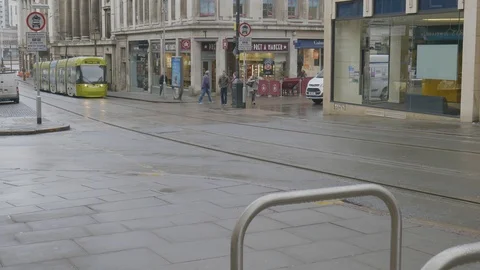 Green tram passing through the streets of Nottingham Stock Footage 112972439