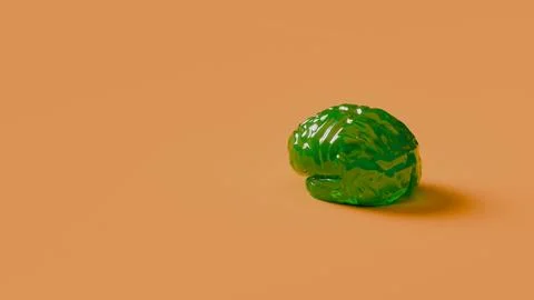 Green translucent 3D brain model on smooth orange background with shadow.. Stock Photos