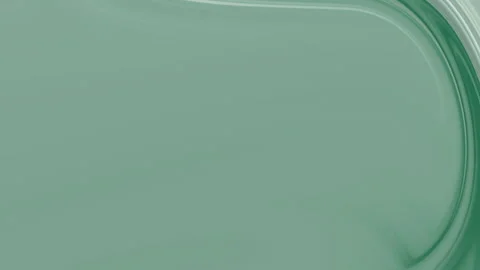 Green Translucent Liquid Swirling in Smooth Abstract Macro Background 스톡 동영상 333975163
