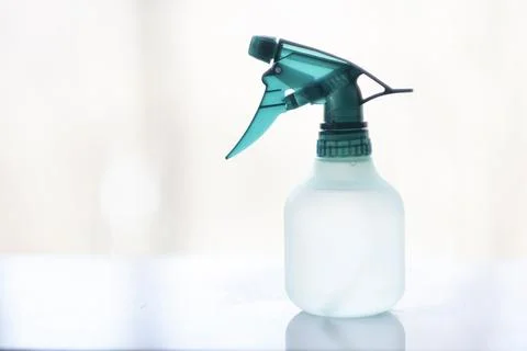 Green Transparent Spray Trigger Bottle on White Surface Photos