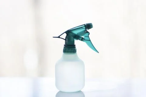 Green Transparent Spray Trigger Bottle on White Surface Photos