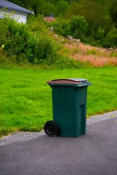 Green trash can with two separate chambers 스톡 사진