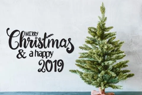 Green Tree, Black Calligraphy Merry Christmas And A Happy 2019 Stock Photos