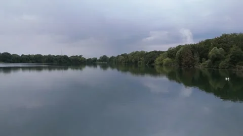 Green Tree Lined Lake Shore Reflection Aerial View Stockbeeldmateriaal 343025679