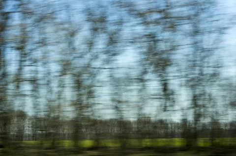 Green trees - a blurred window view from train in motion Stock Photos