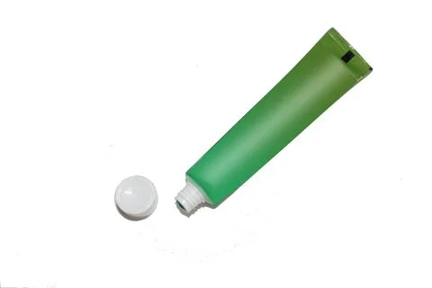 Green tube of toothpaste Stock Photos