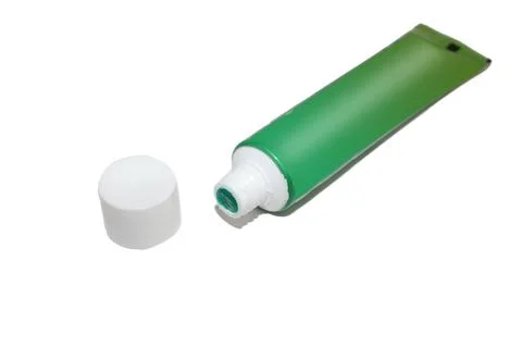 Green tube of toothpaste Stock Photos