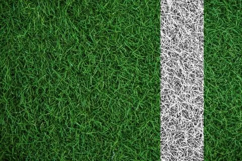 Green turf grass texture with white line, in soccer field Stock Photos