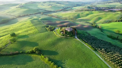 Green Tuscany fields during spring time drone footage Stock Footage 258457630