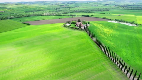 Green Tuscany fields during spring time drone footage Stock Footage 258457672
