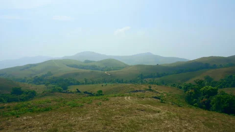 Green valley and mountain range with moody sky	 Stock Footage 150416576