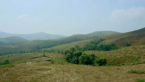 Green valley and mountain range with moody sky	 Stock Footage 150416758