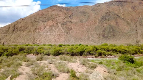 Green valley and river view from train window in the mountains of Kyrgyzstan. Stock Footage 315025426