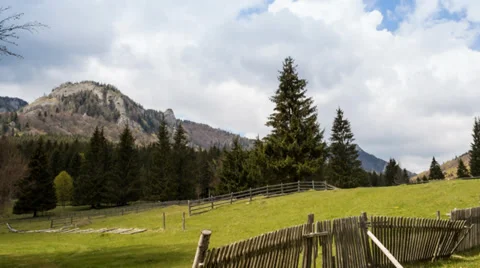 Green valley between mountains with cottage in the spring Stock Footage 37809495