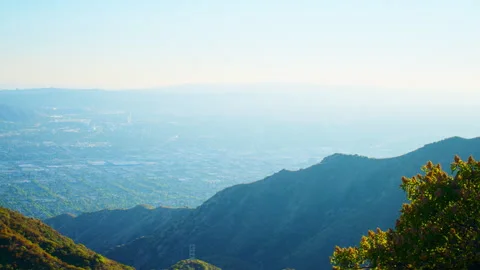 A green valley with cool tones under a clear blue sky at the Beaudry Loop Hike Stock Footage 282000675
