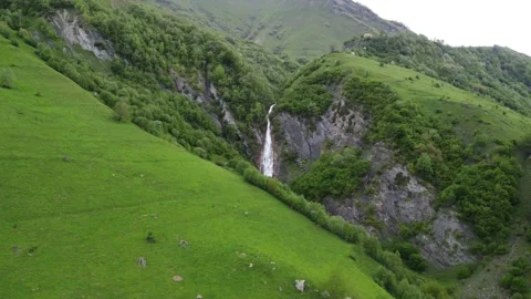 A green valley that leads to a waterfall Stock Footage 199389970