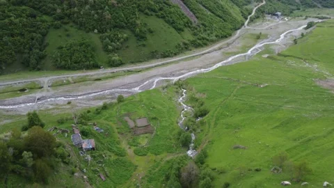 A green valley with rivers between mountains Stock Footage 199395062