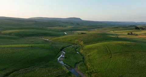 Green valley at sunrise Stock Footage 248944703