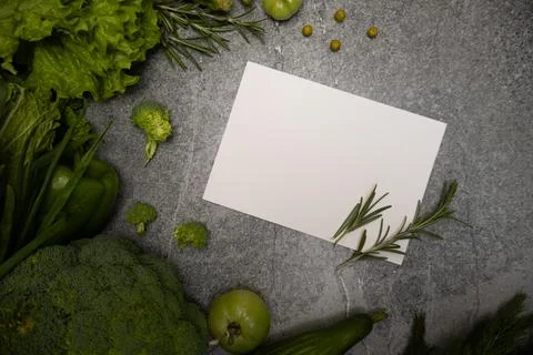 Green vegetables background with card message Stock Photos