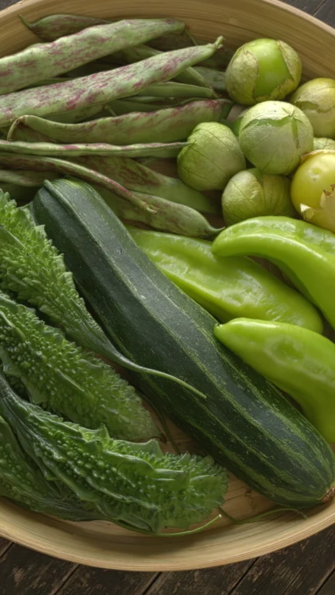 Green vegetables on a bamboo tray. Vertical video. Stock Footage 280105257