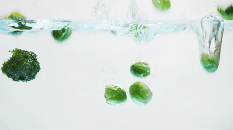 Green Vegetables Falling into Water 003 Stock Footage 67889563