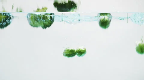 Green Vegetables Falling into Water 004 Stock Footage 67889610