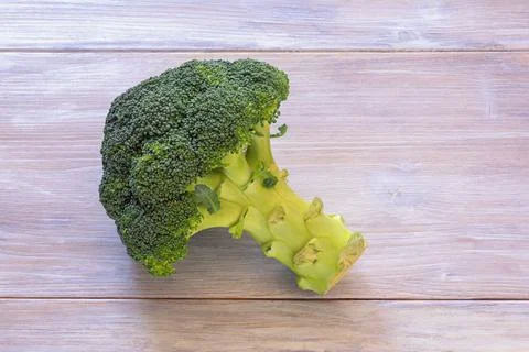 Green vegetables. Fresh broccoli on rustic table. Copy space Stock Photos