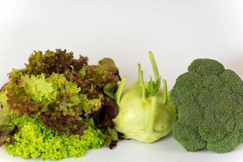 Green vegetables on a white background Stock Photos
