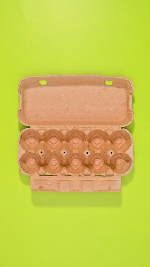 Green Vertical background with paper eco friendly basket with eggs. Stop motion Stock Footage 283265841