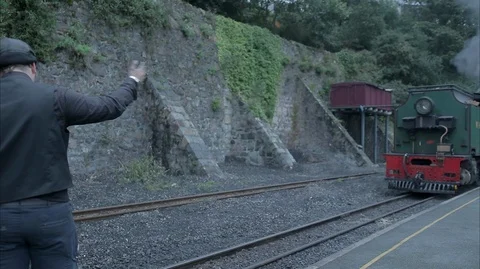 Green Vintage steam Train Engine arriving in the station Stock Footage 128368361