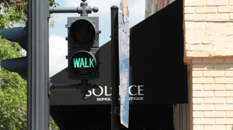 Green walk light changes to a flashing amber wait light Stock Footage 37255387