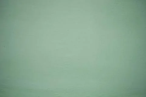 Green wall texture for background use. Pastel colors. Stock Photos