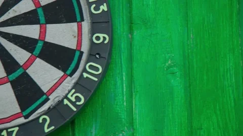On the green wall there is a board and a dartboard. Stock Footage 196950874