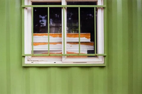 Green Wall Window With Metal Security Bars Stock Photos
