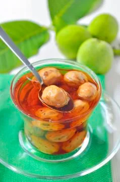 Green walnut jam Stock Photos