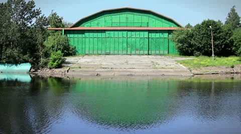 Green Warehouse on the riverbank Stock Footage 24941796