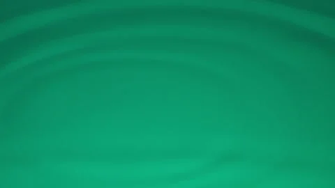 Green Water Drops falling into the water producing waves and ripple effects. Stock Footage 317933489