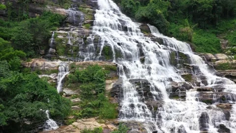 The Green-Waterfall-River-rocks-covered-with-green-moss-Forest-Waterfall  Stock Footage 199599855