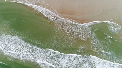 Green Waves Breaking on the Sand from above 動画素材 96271377