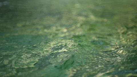 Green waves on the pond of a mountain stream (abstract, slow motion) 스톡 동영상 260844372