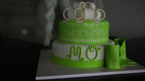 Green wedding cake with word "MO Video stock 65682106