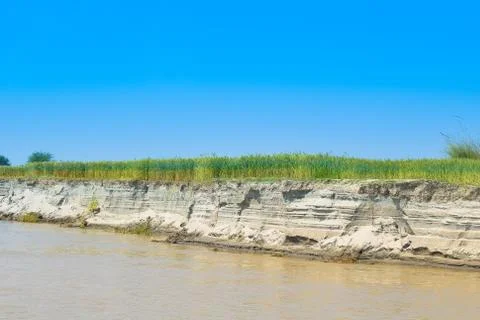 Green wheat fields on the bank of river indus Stock Photos