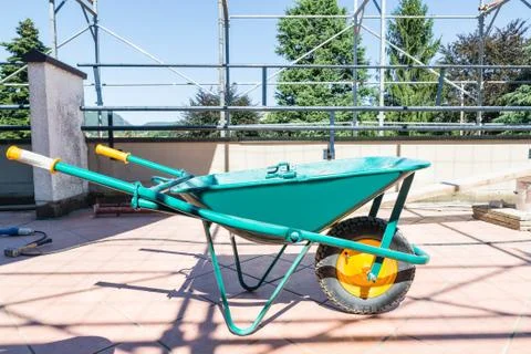 Green wheelbarrow Stock Photos