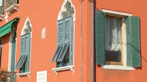 The green windows of the orange house Stock Footage 82191361