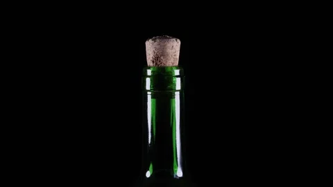 Green wine bottle rotating 360 degrees on a turntable Stock Footage 277498128