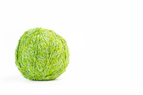 Green wool ball on a white background with copy space Stock Photos