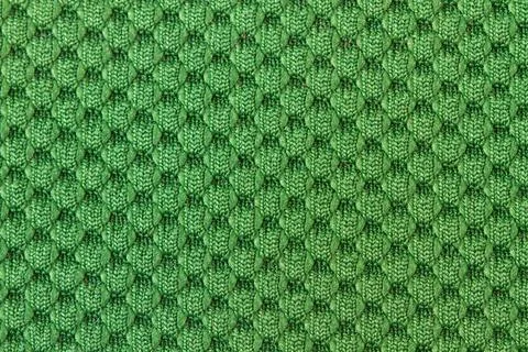 A green wool cloth texture in a close up view Stock Photos