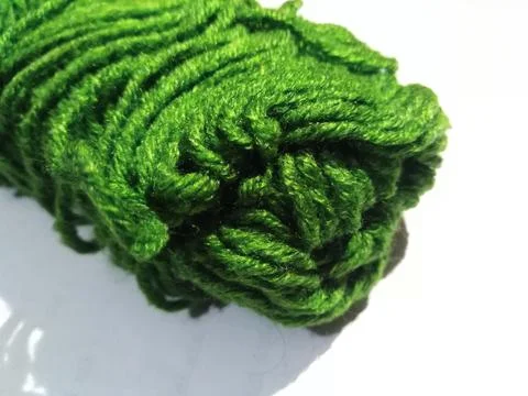 Green Wool yarn on white background. Stock Photos