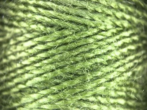 Green yarn thread texture close up macro concept for knitting, textile industry, 库存照片